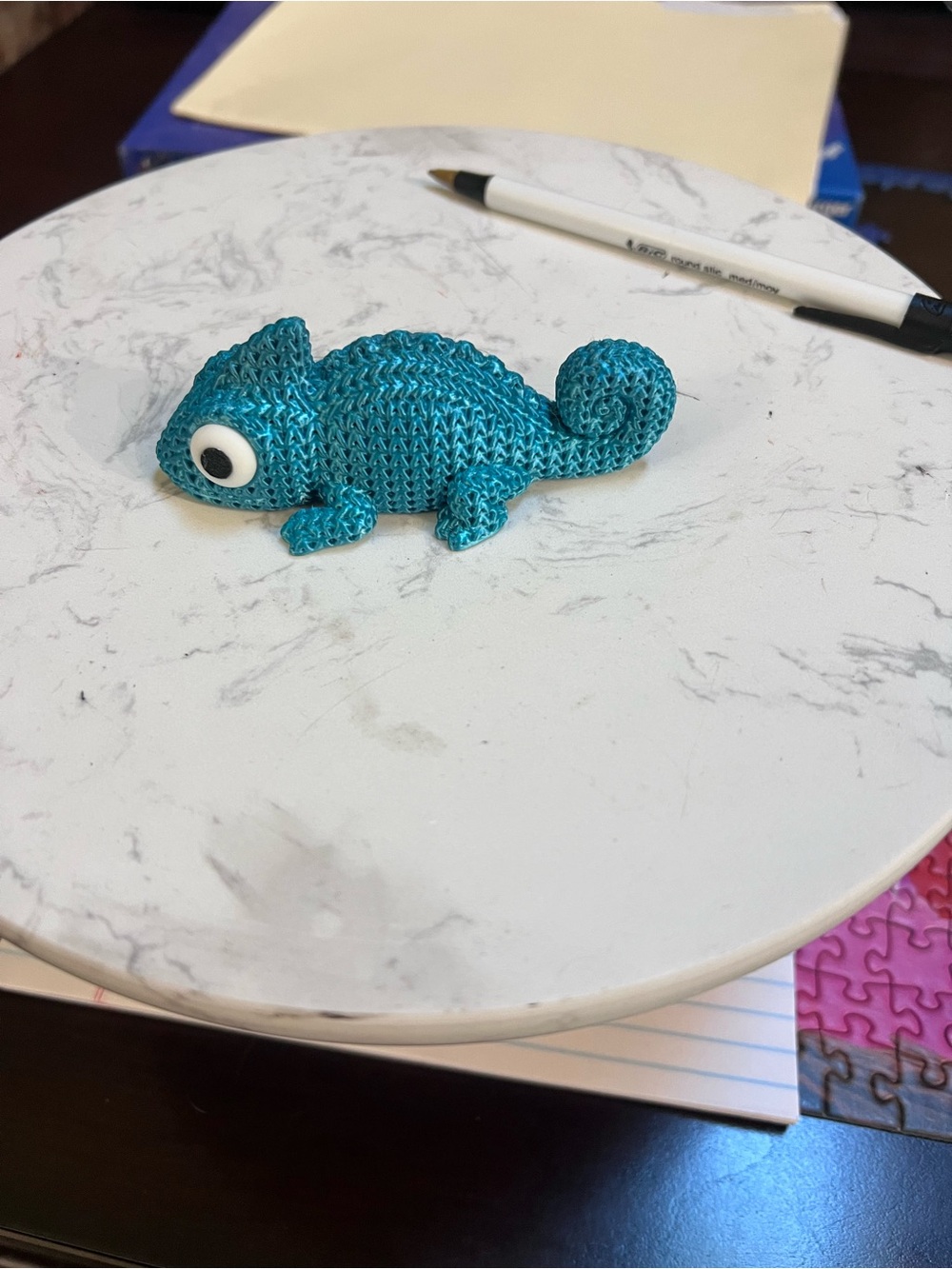 3d printed crochet chameleon.